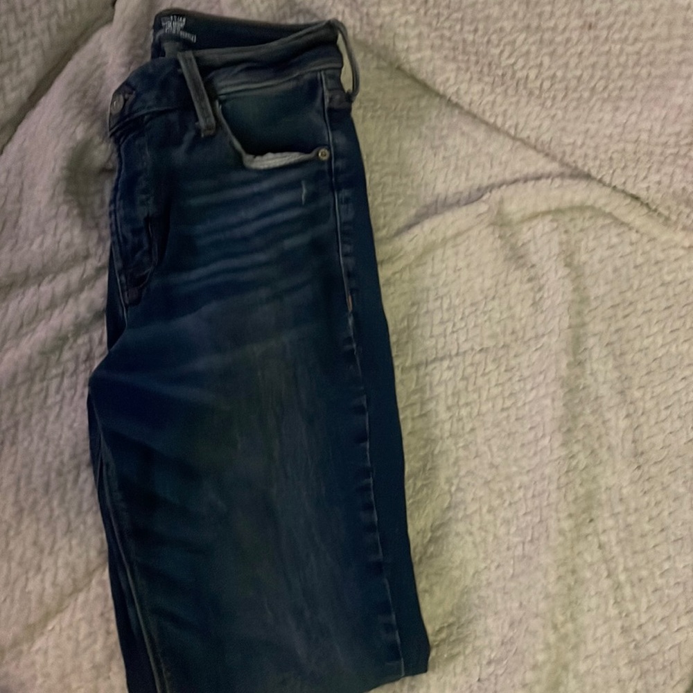 Jeans. Worn a couple of times. Dark blue denim.